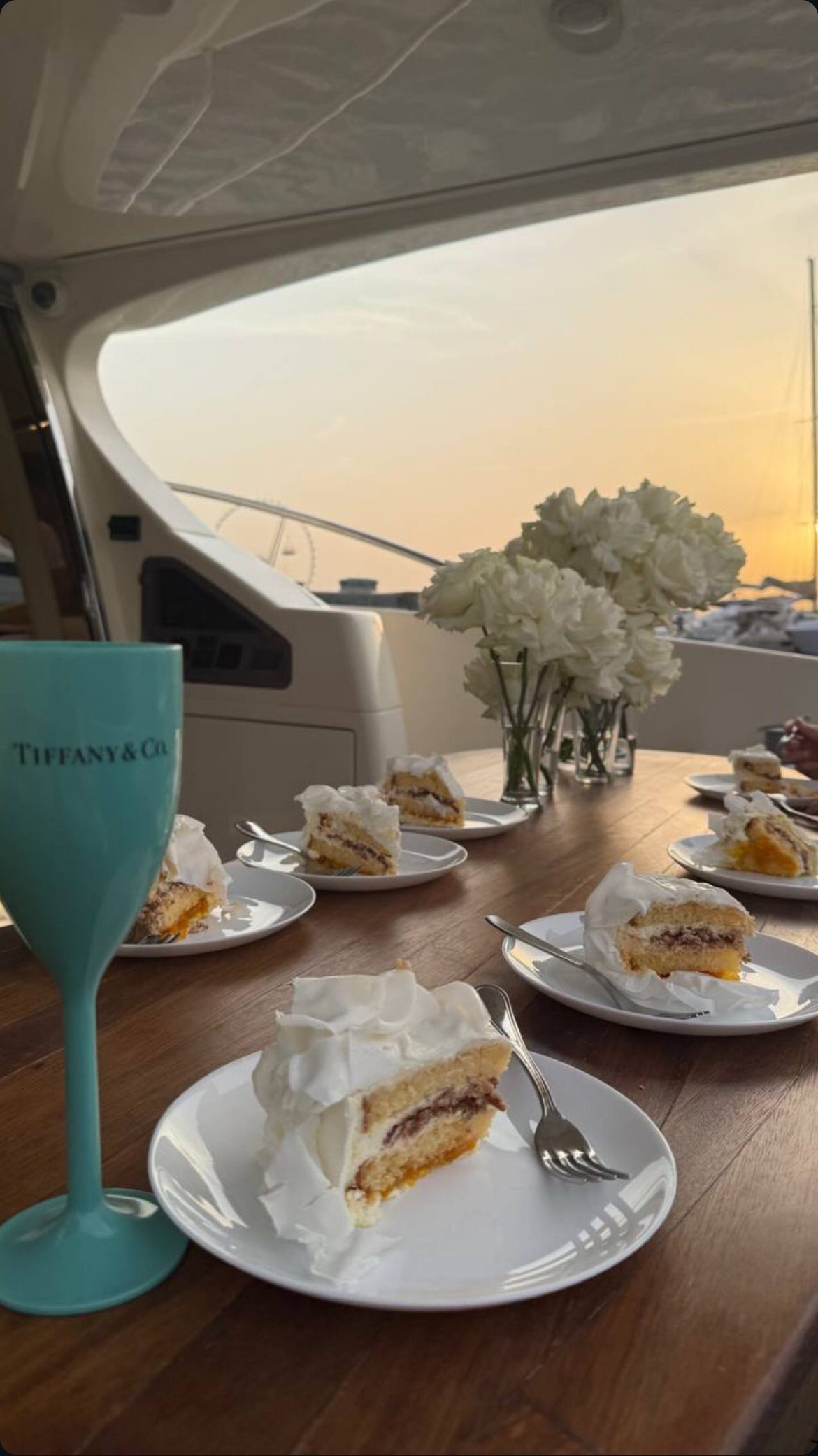 Elegant dinner table setting at sunset on a yacht
