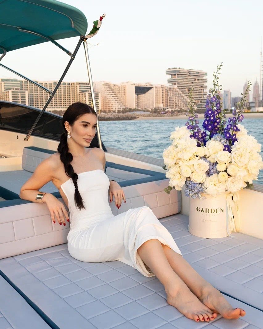 Bride in a white dress on a yacht deck